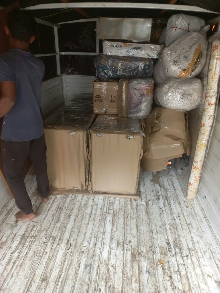 Systematic loading of a moving vehicle to ensure the safety of all packed items during transit.