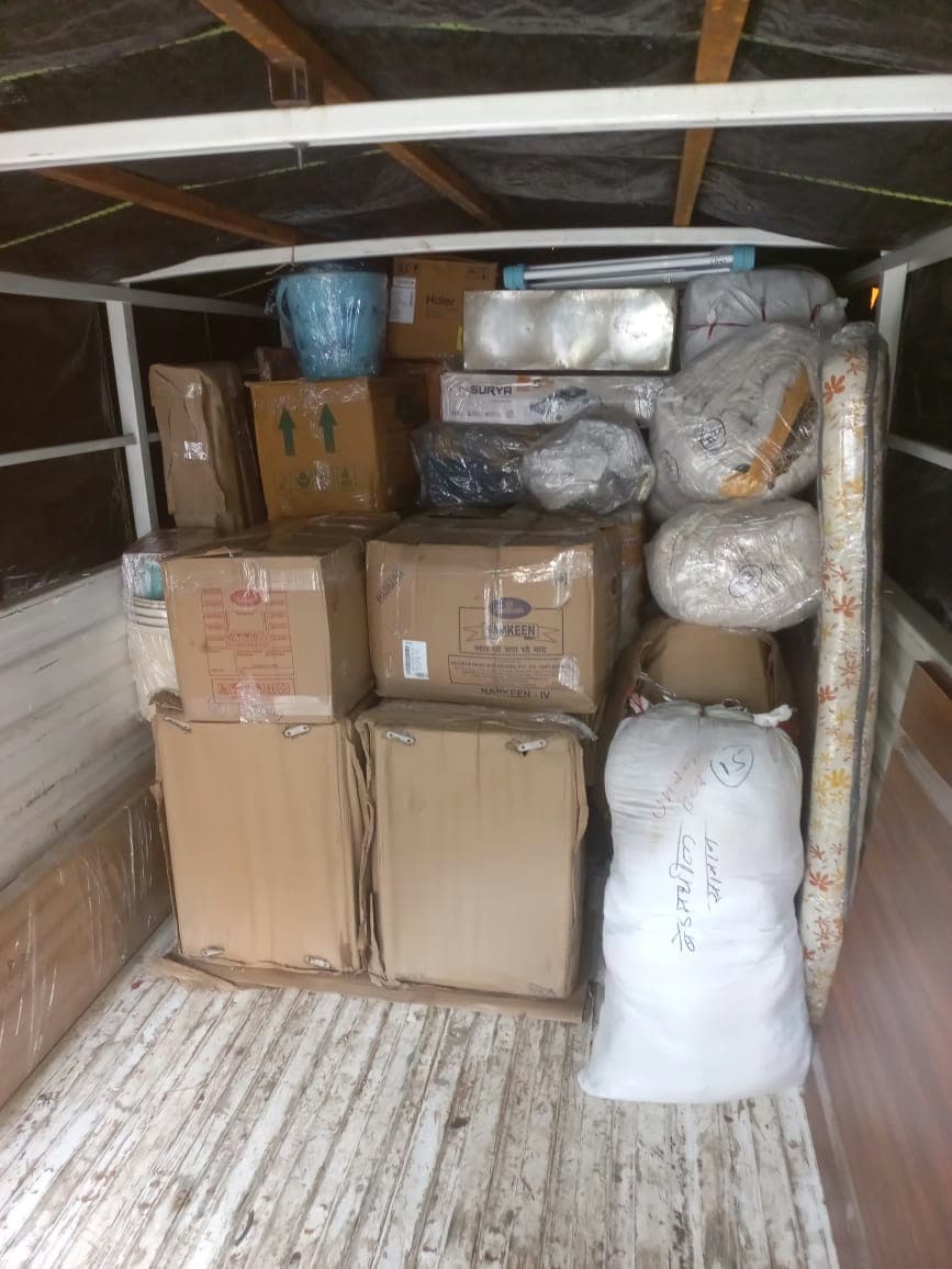 A fully loaded moving truck, demonstrating our capacity to handle large-scale home relocations.