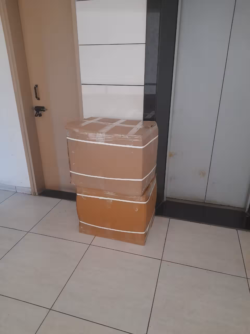 Packed and labeled moving boxes ready for loading and transit.