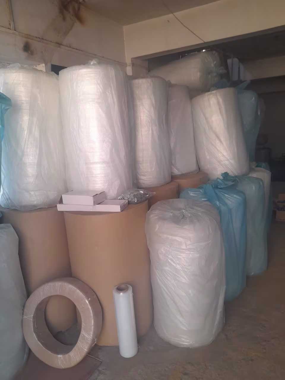 Industrial-grade packing supplies like bubble wrap and cardboard rolls.