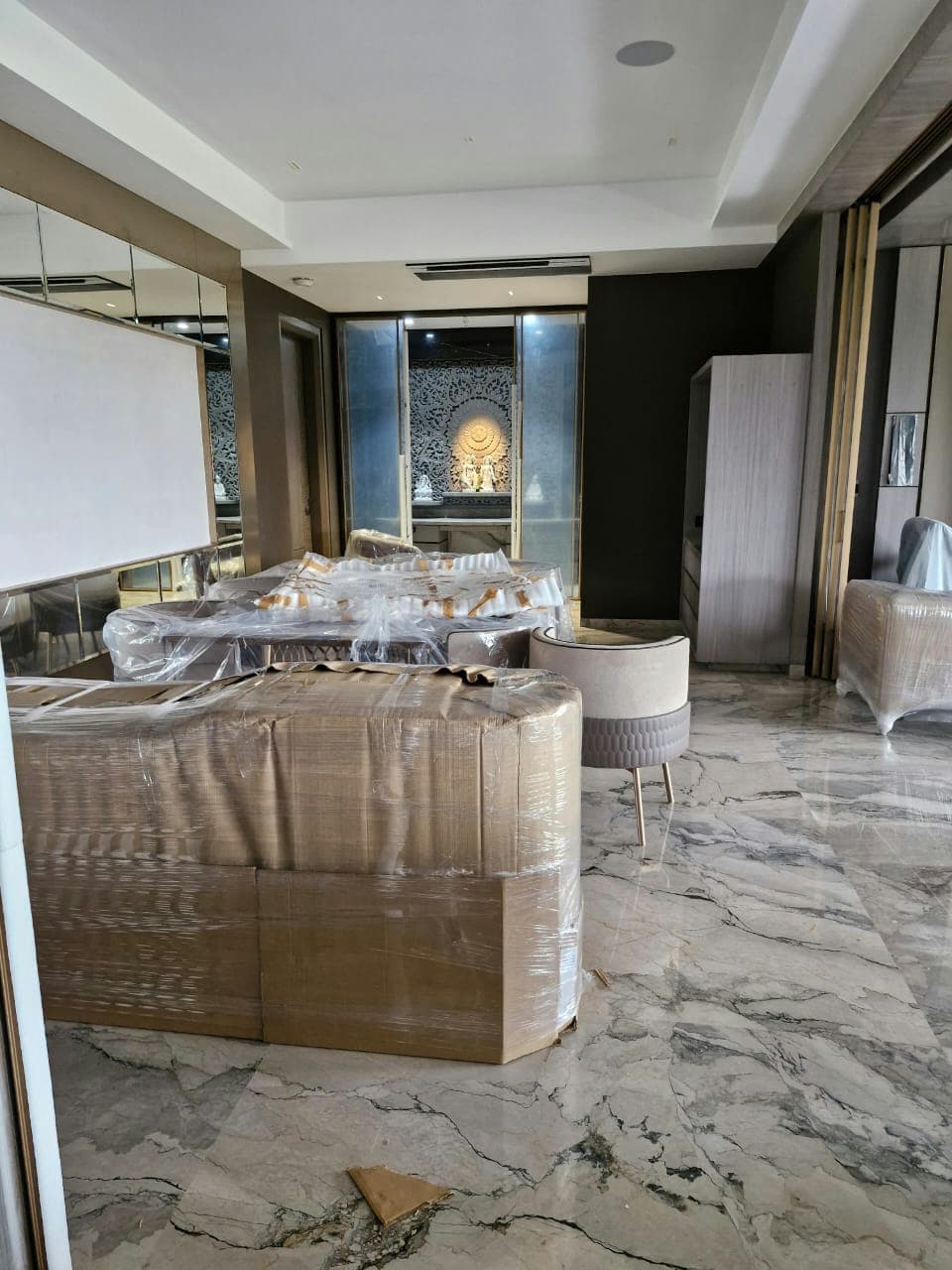 Packed luxury furniture inside a modern home, awaiting our careful moving team.